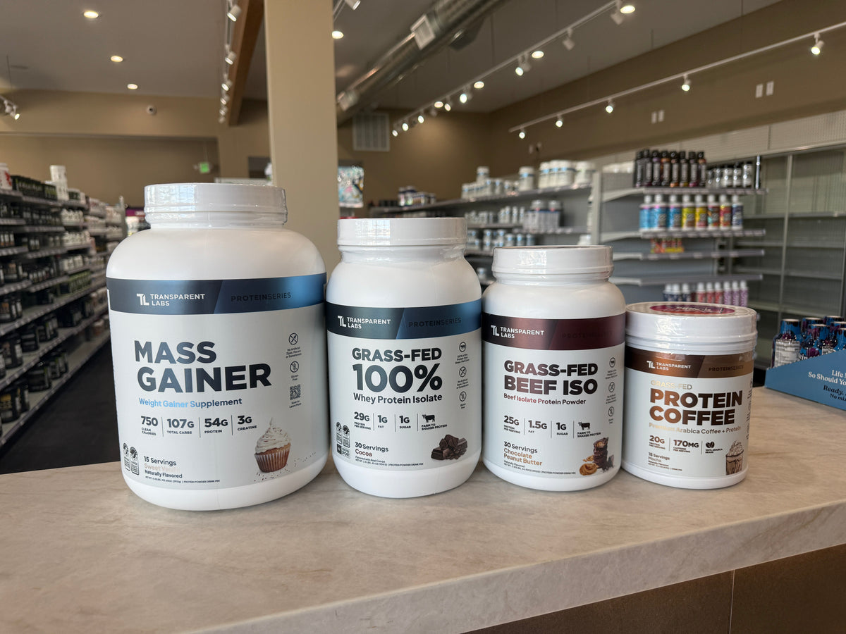 Transparent Lab's protein powder line up, Mass Gainer, Grass-fed 100% Whey Isolate, Grass-Fed Beef Iso, Protein Coffee (left to right)